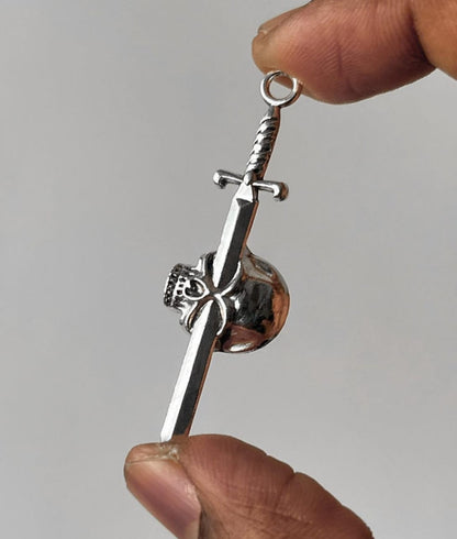 Pierced skull pendent