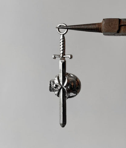 Pierced skull pendent